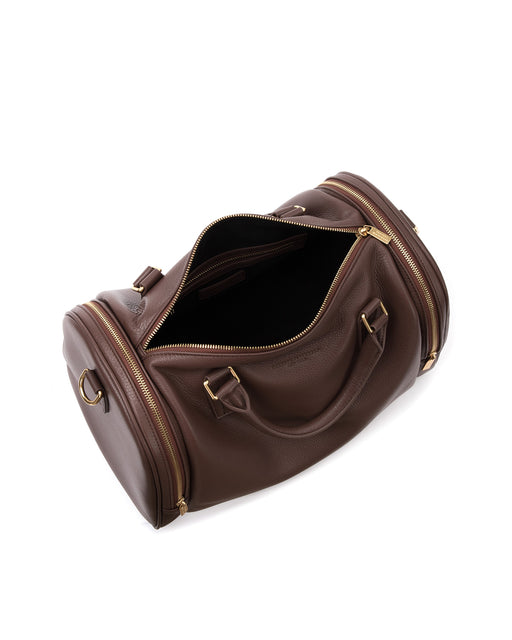 Angled over head view of wide open Medium Duffle in brown grain leather with brass Brandon Blackwood Logo brown leather handle and double sided brass zipper closure 