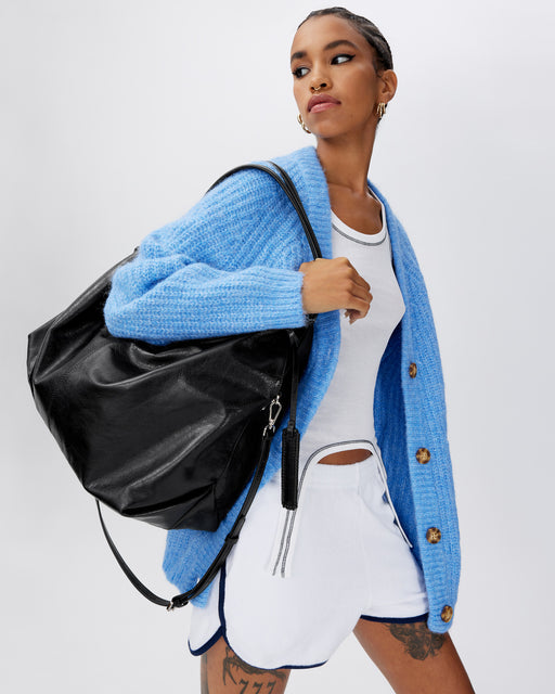 Model posing with Hobo Tote Bag in Black Cracked Leather with Silver Hardware