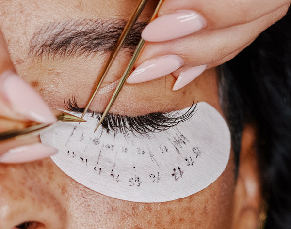 Isolating and applying eyelash extensions