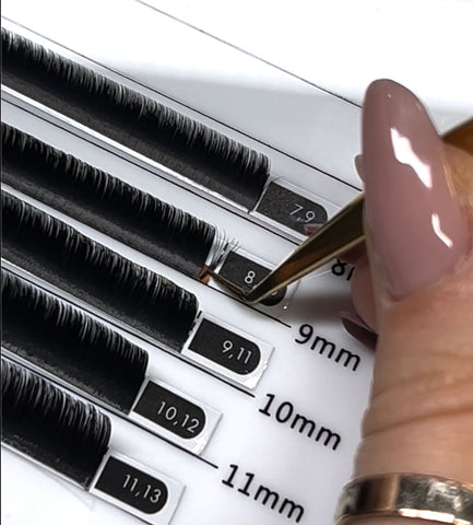 Picking up lash extensions with tweezers