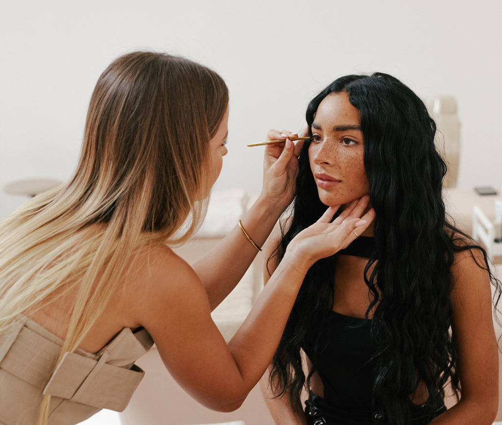 Woman who is learning to do lash and brow treatments