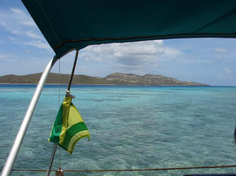Taking a catamaran to Culebrita Island with Culebra, Puerto Rico, flag waving.