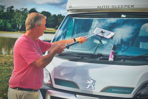 someone using drysparkle cleaner and extendable mop to clean his motorhome