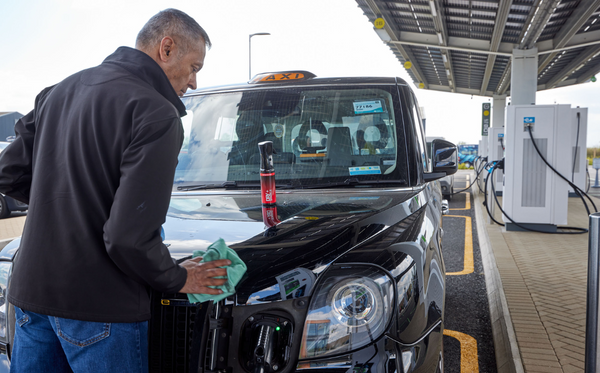 someone cleaning his car by hand with DrySparkle product