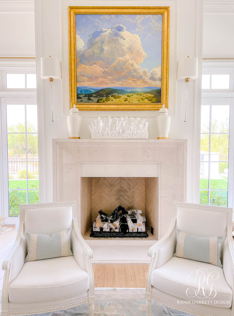 Custom commissioned original oil painting over fireplace mantle in light and bright living room