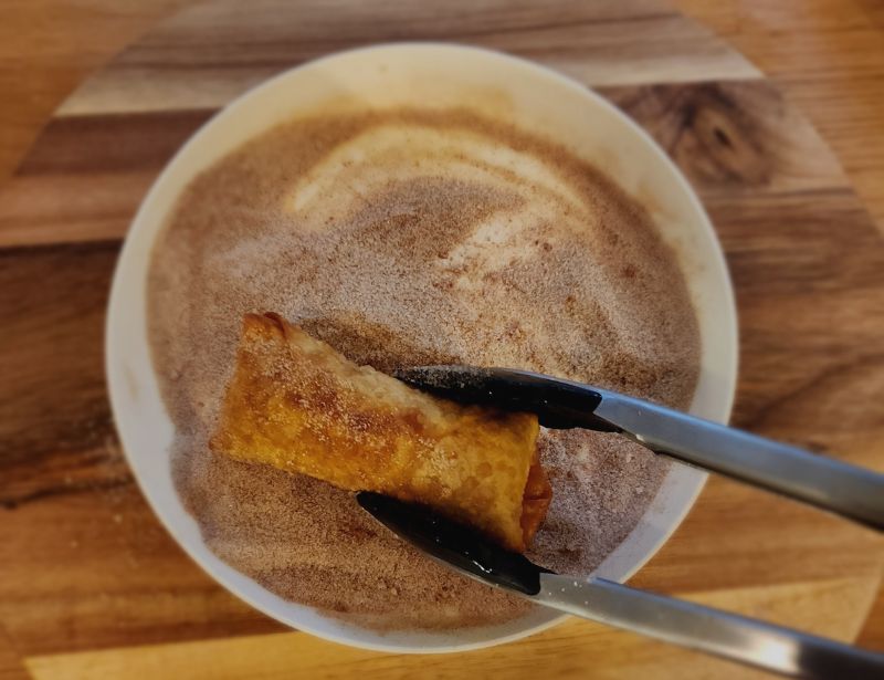 Churro Cheesecake Eggrolls on sugar, cinnamon, and salt mix