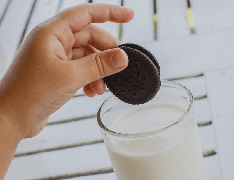 Dipping-Oreo-in-a-glass-of-milk