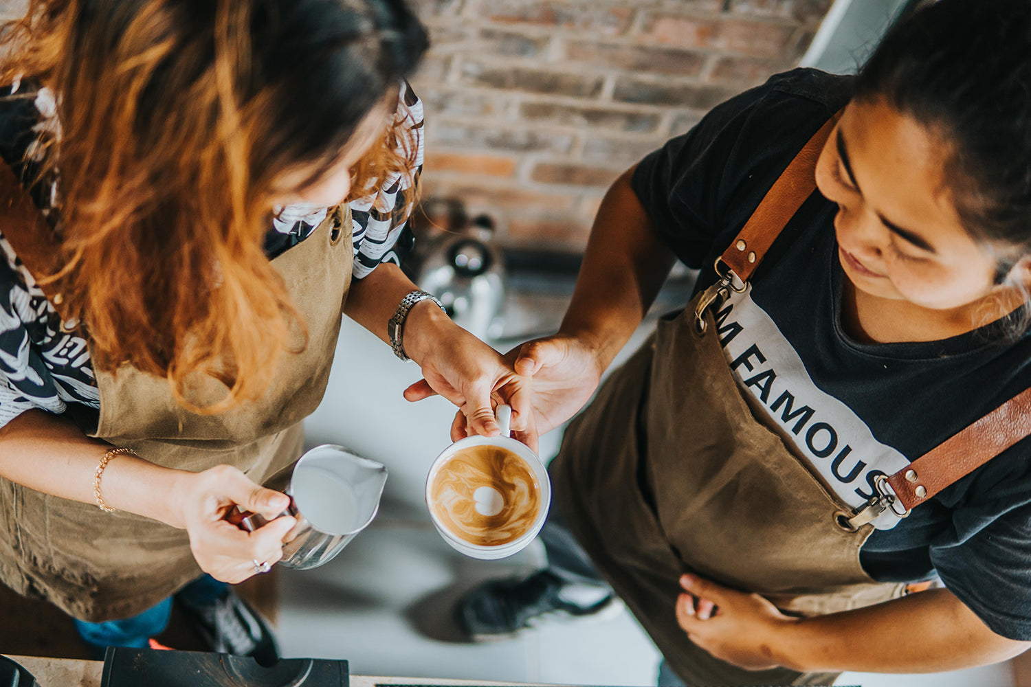 Two baristas making coffee