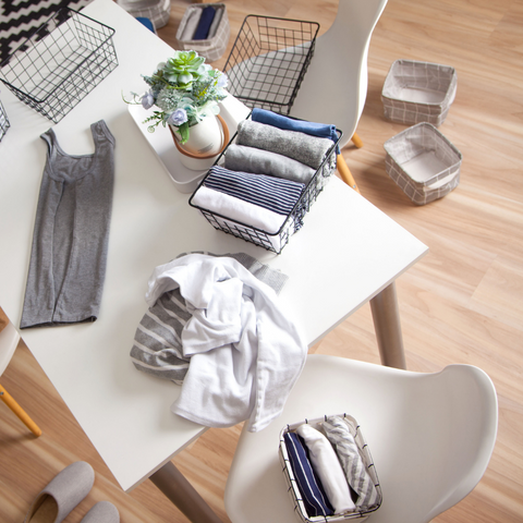 An image of clothes folded using Marie Kondo's method and stacked vertically