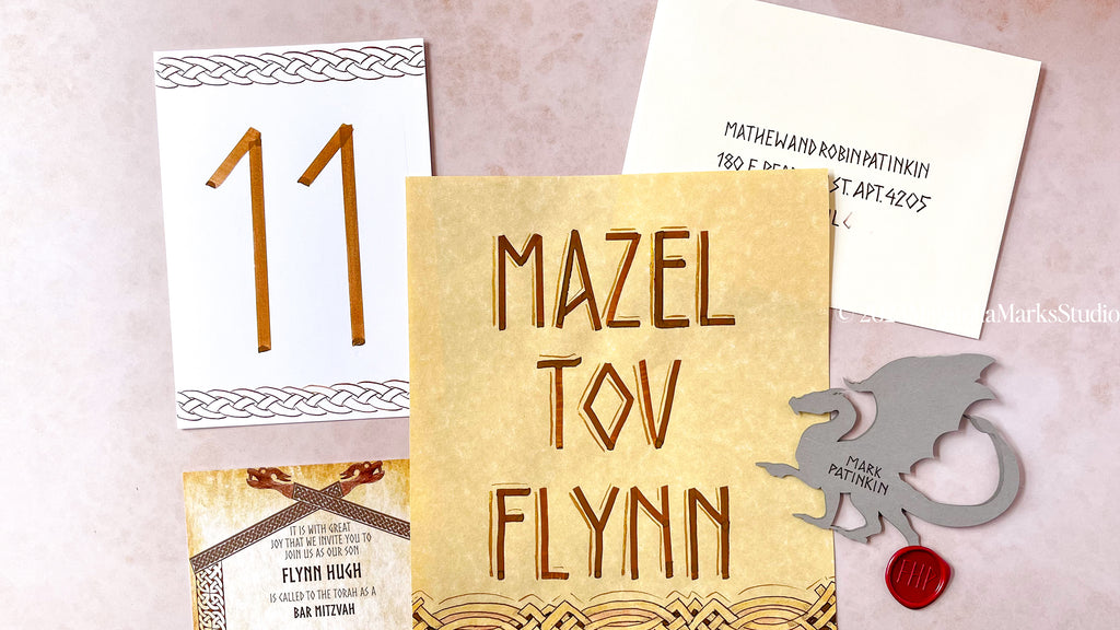 Flat Lay of Custom Bar Mitzvah Paper Goods and Wax Seal