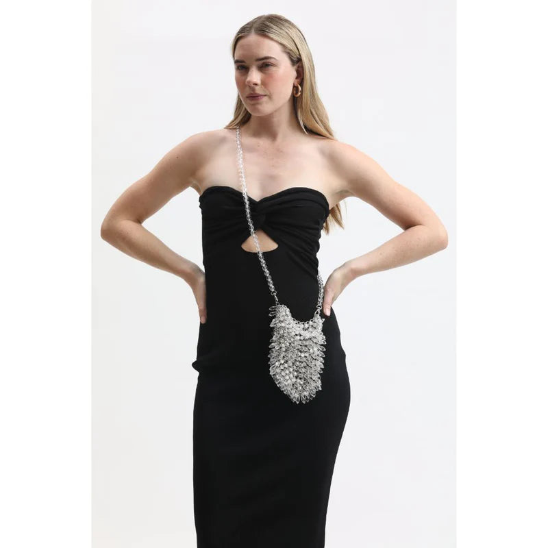 woman carrying silver evening bag with rhinestones