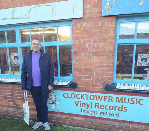 outside clock tower record shop in Bridport, Dorset.