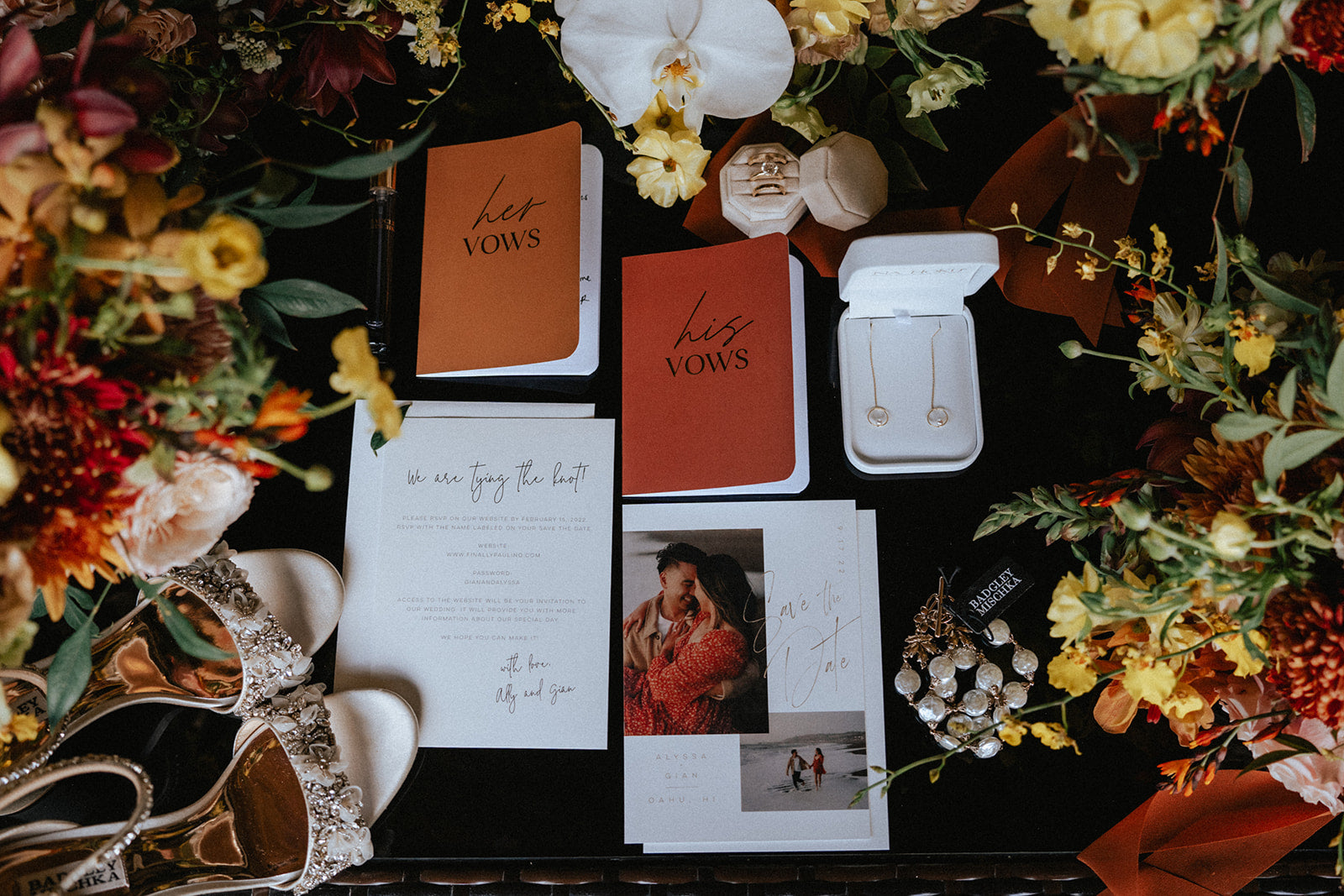 Layflat of autumn florals and wedding vows, accessories and rings