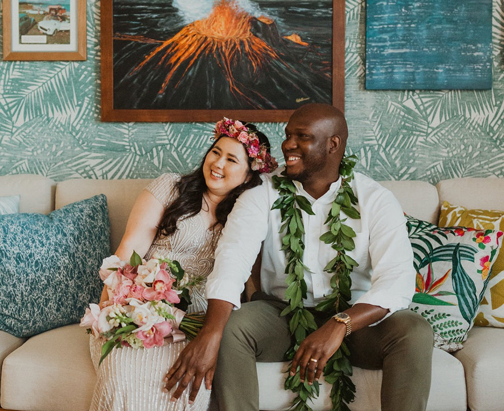 Bride and groom, Emily and Keron sitting in a hotel suite at the Kaimana Beach Hotel by Sheyanne Lyn Photography