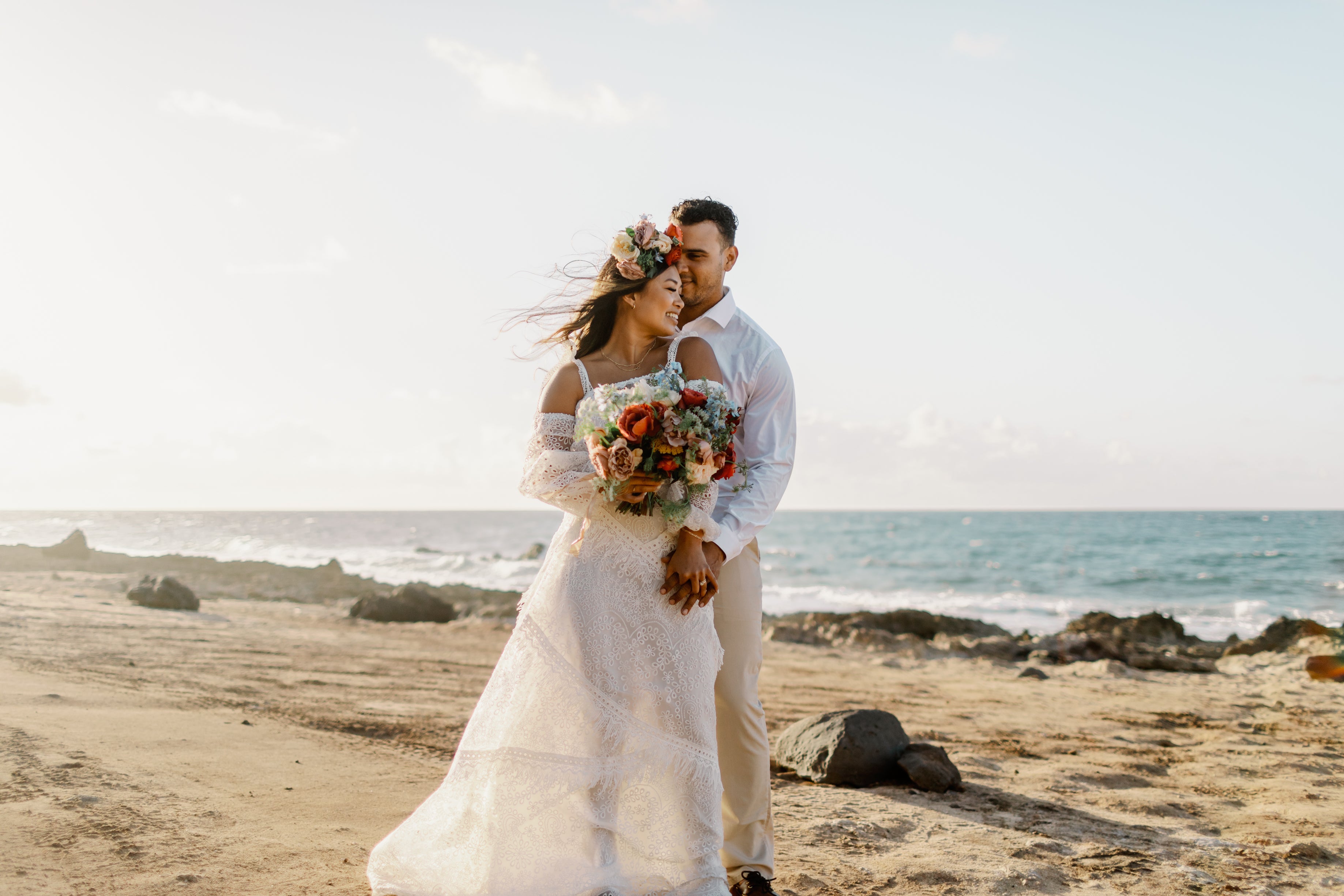 Couple eloping on the beach in Hawaii