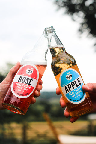 Raising two bottles of PULP Low Alcohol 0.5% Cider