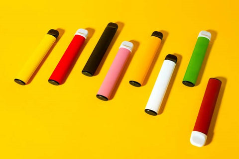 Layout of colorful disposable electronic cigarettes with shadows on a yellow background. The concept of modern smoking, vaping and nicotine. Top view Layout of colorful disposable electronic cigarettes with shadows on a yellow background. The concept of modern smoking, vaping and nicotine. Top view. disposable vape