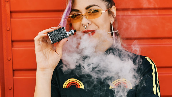 nose-ringed teen vaping