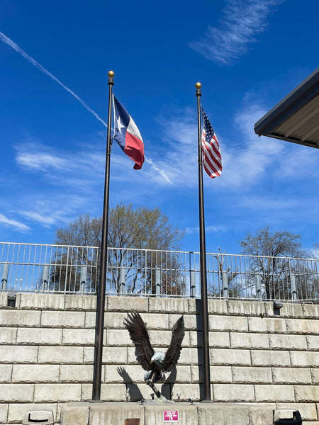 Flagpoles with texas and american flags