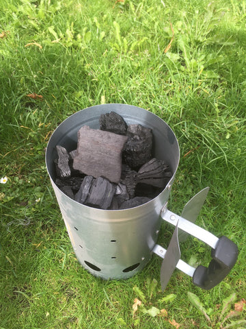 Filling the smoker with charcoal