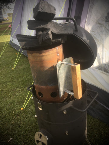 Charcoal stacked high on the chimney starter