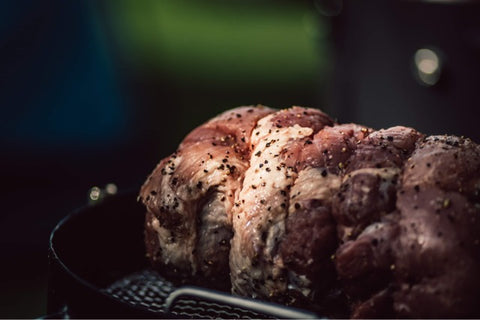 Pork cooking on the smoker