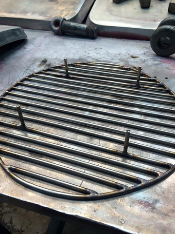 A fabricated ash grate for my el cheapo budget smoker modification