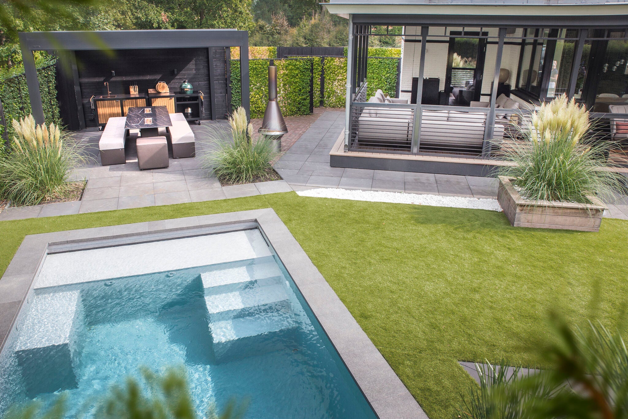 Luxury garden with swimming pool and outdoor kitchen