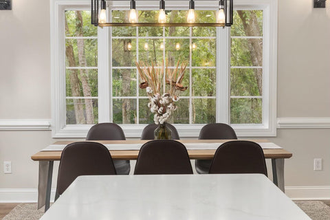 dining room with a wooden table and black chairs