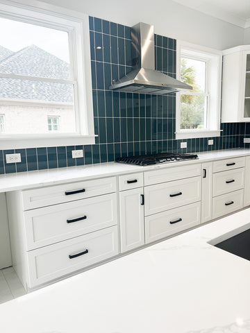 White Kitchen with Blue Backsplash