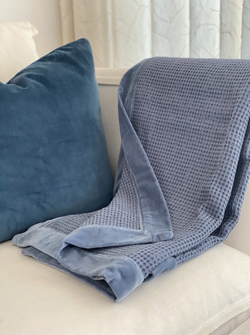 luxurious throw in light blue for the colder spring nights from maison demetriades interior design studio cyprus and london
