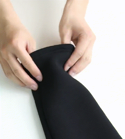 Flipping the Thinsulate Fleece Leggings inside out to show the elasticity of the fabric as well as denseness of the fleece