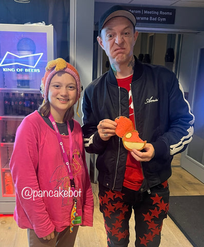 Joel Zimmerman with Lily "Fish Lord" Penelope, Co Creator of PancakeBot, holding a partially eaten DeadMau5 Pancake.