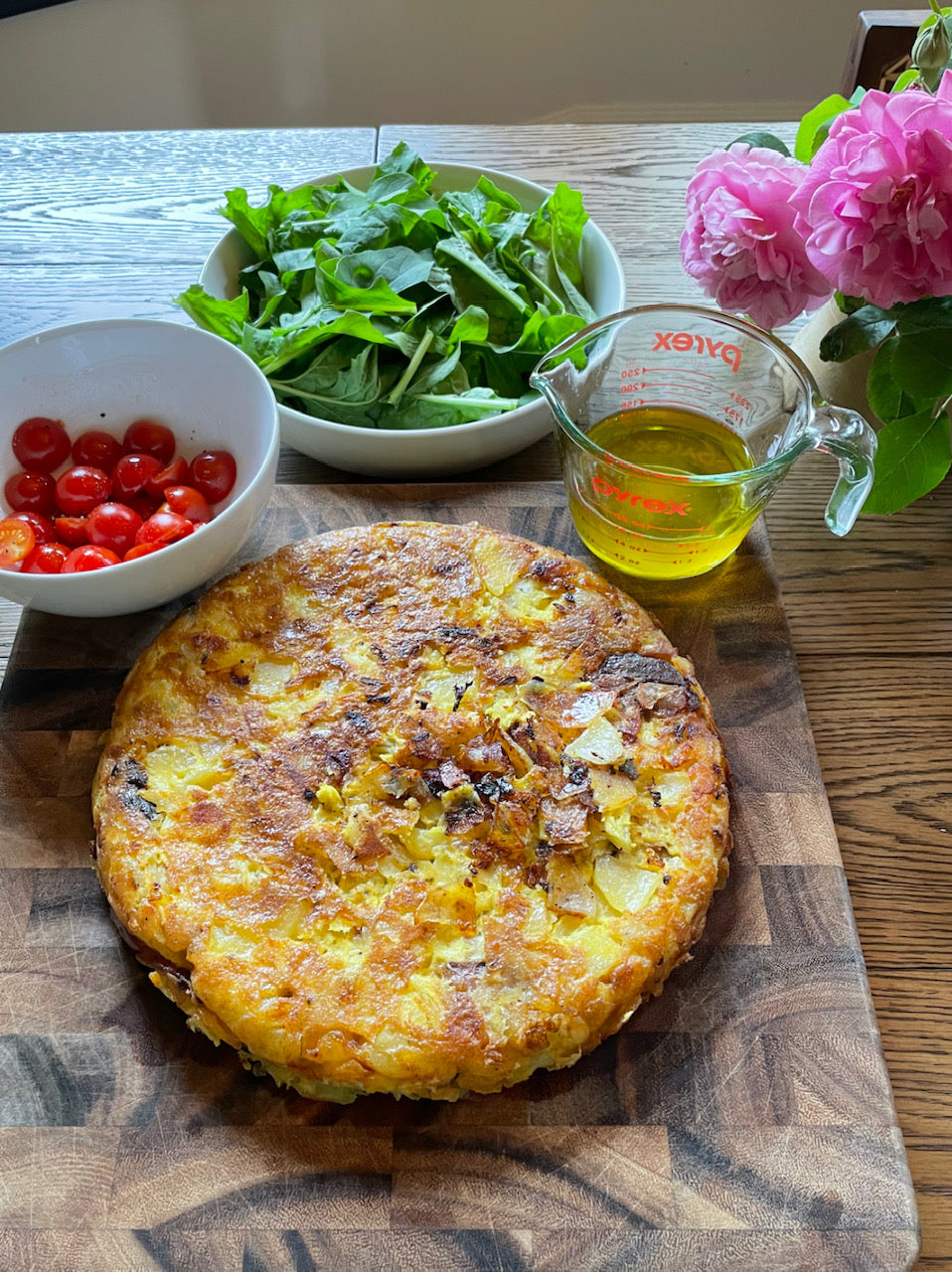 spanish omelette on a wooden cutting board