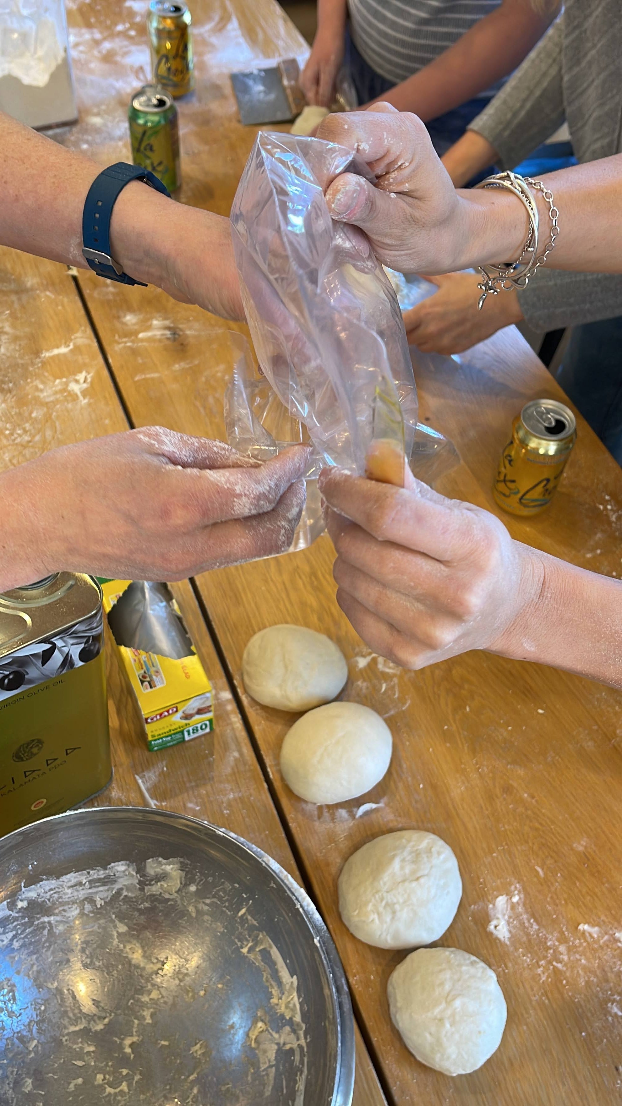 Place pizza dough balls into lightly greased bag or container