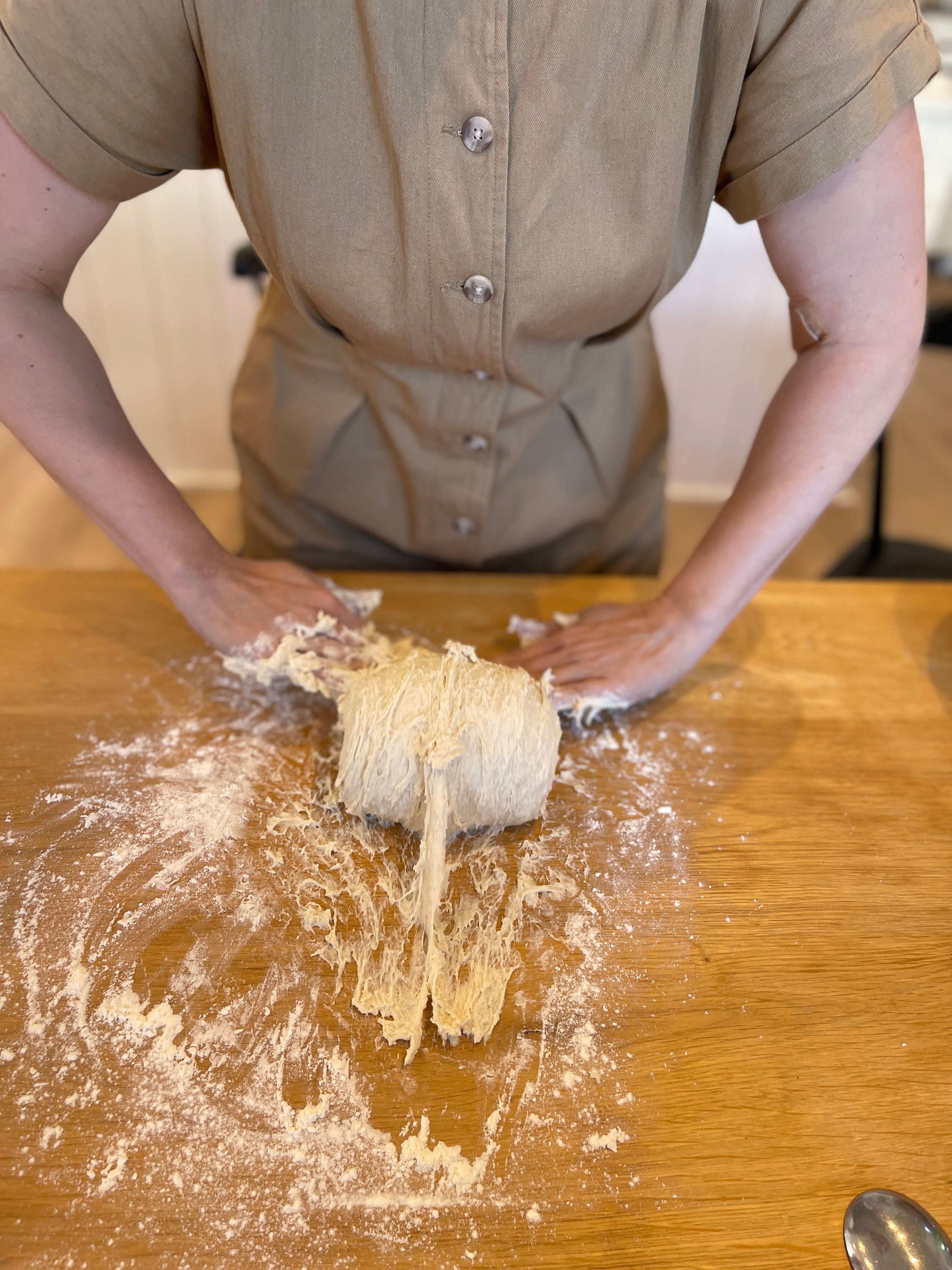 Kneading sticky pizza dough