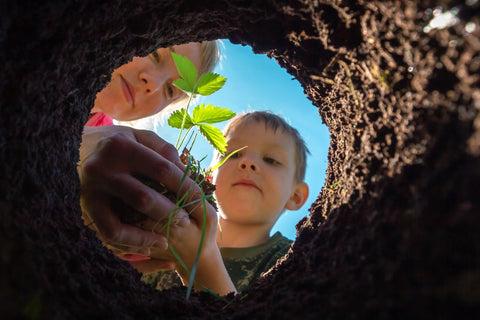 kids planting in a pot