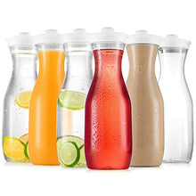 Load image into Gallery viewer, Plastic Carafe Water Pitcher - Carafes for Mimosa Bar - Clear Juice Containers with Flip Top lids - Narrow Neck Easy Grip Wide Mouth - Party juice carafe – BPA Free – Not Dishwasher Safe(6 Pack 32 Oz)
