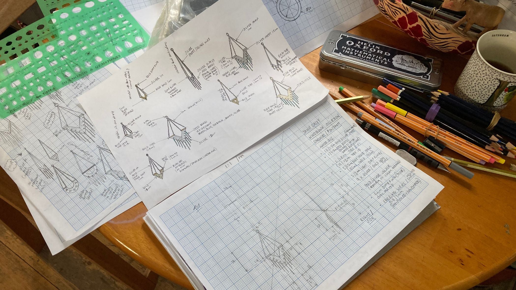 Initial sketches and drawings, transferred into technical drawing on graph paper, showing various perspectives of an earring from the Windblown collection.