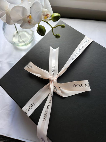 black gift box with ribbon