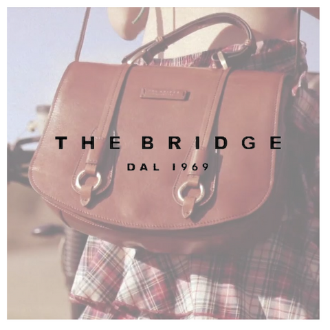 The Bridge: il logo con in trasparenza una borsa in cuoio