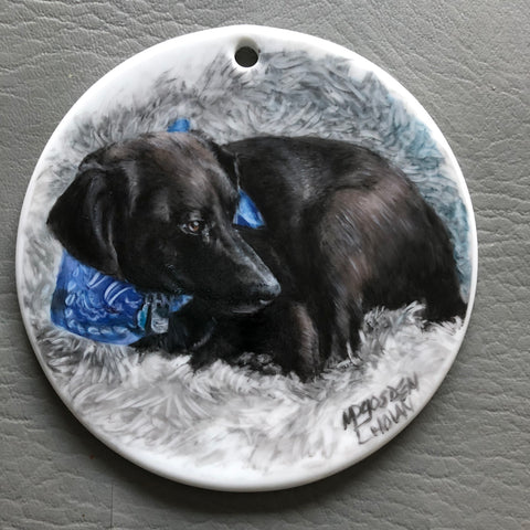 round ornament with black dog