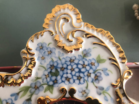 close-up of blue flowers on porcelain photo frame