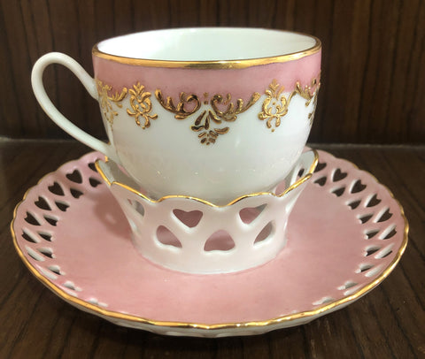 pink and gold tea cup