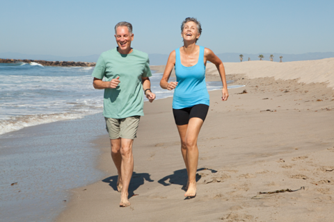 A couple running in the beach