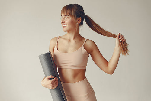 Women Holding Her Yoga Mat