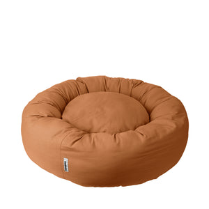 a light brown donut bed