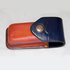 Leatherman Wave Sheath - ready product - Hand made sheath for Leatherman Wave. Veg tanned cow leather wet moulded over 3d printed form. Dyed orange and blue. Stamped with Taurus star sign around snap button closure. Belt slider at the back. Hand stitched with Tiger thread in 0,8mm