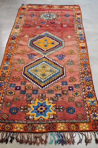 Boho Vintage moroccan rug that is red, blue and yellow