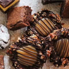 Grazing Dessert Chacuterie style Trove Desserts display with handmade chocolate caramel Turtle Cookies, Fudge Brownies, Nanaimo Bars, and Chocolate Crinkle Cookies